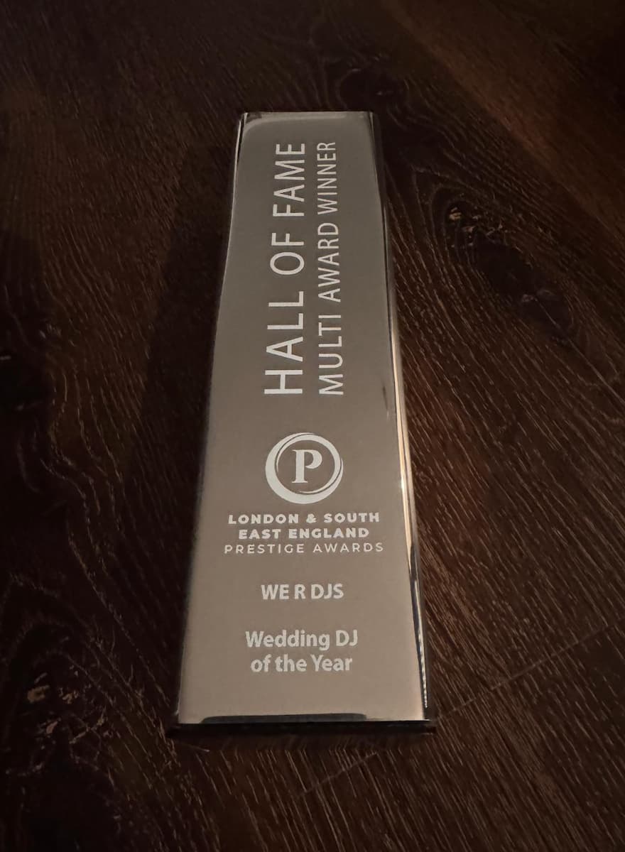 An award plaque recognizing "WE R DJS" as the "Wedding DJ of the Year" at the London & South East England Prestige Awards, indicating a "Hall of Fame Multi Award Winner."